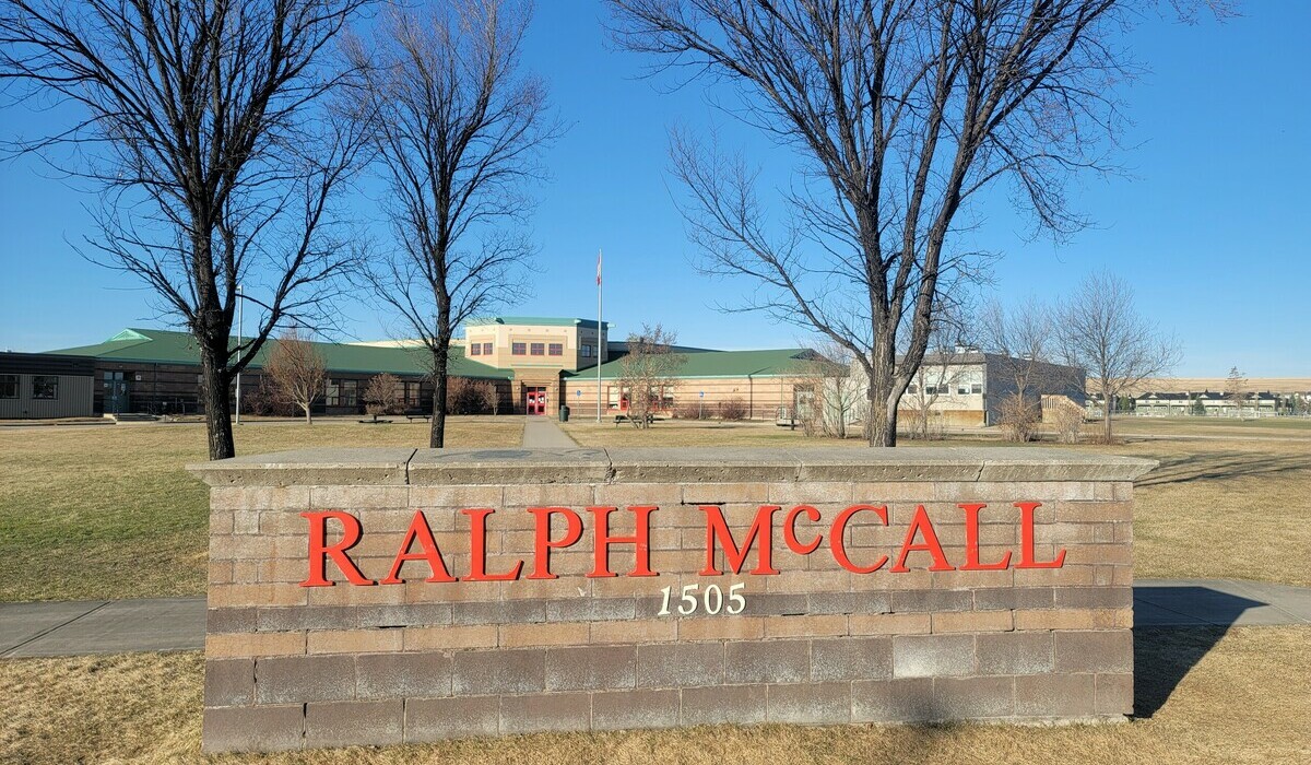 Ralph McCall School with the school sigh in front
